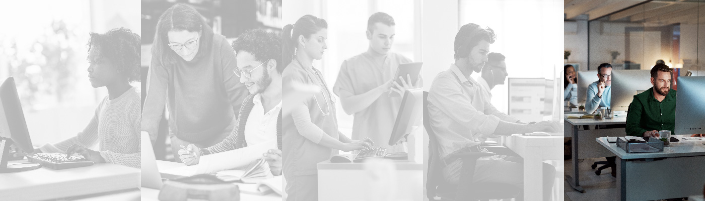 Group of office workers sitting together at their desks