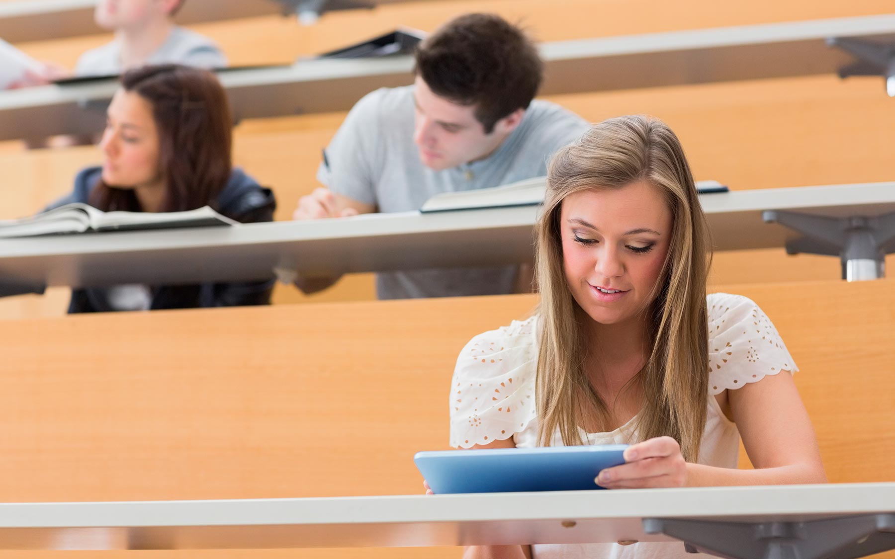 student sitting in lecture hall