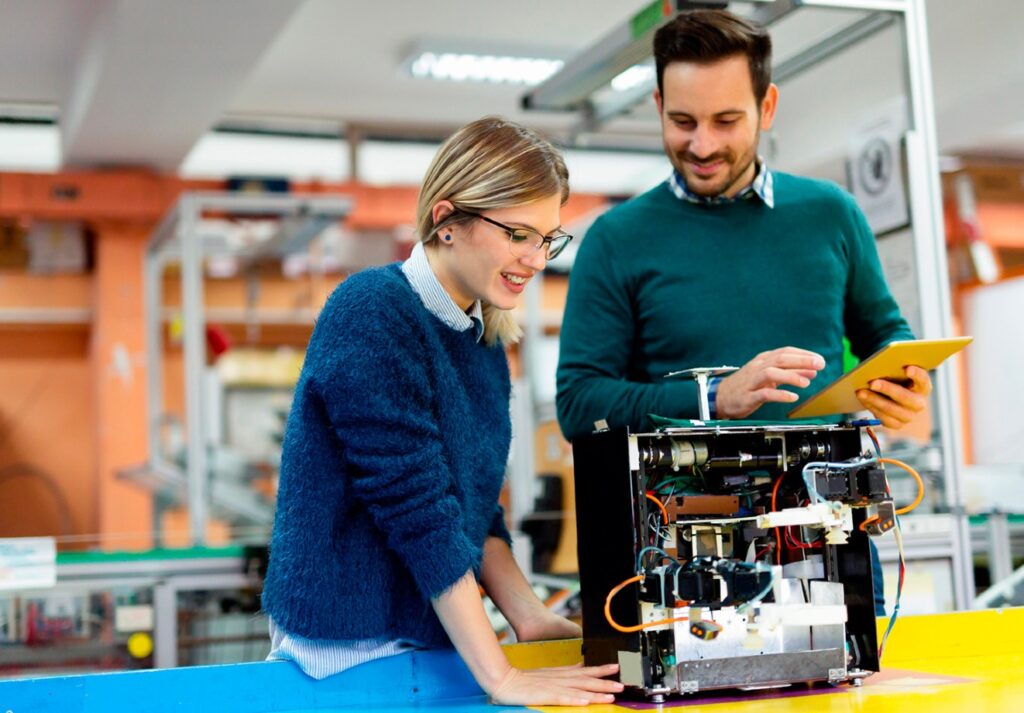 Professor and student working on electronic