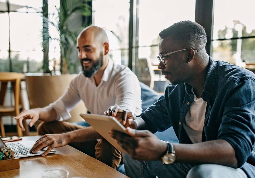 Two men on devices