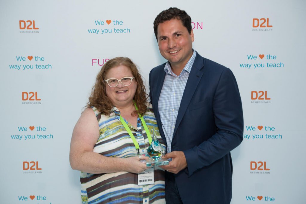 Brightspace Excellence Award winner Dr. Jodi Henderson-Ross with D2L CEO John Baker