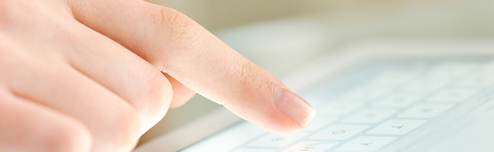 Finger pointing to iPad