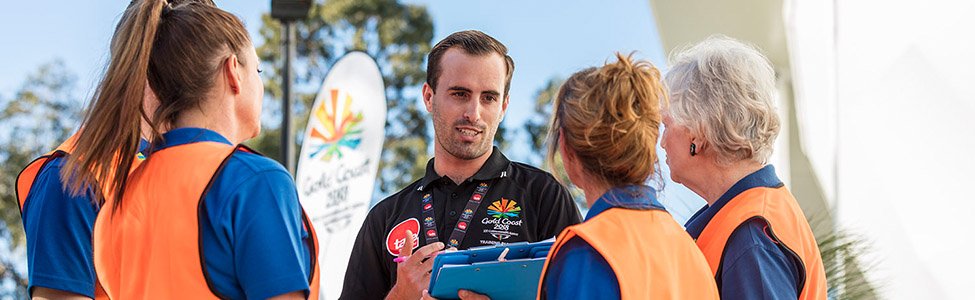 Male talking to group with tafe t-shirt