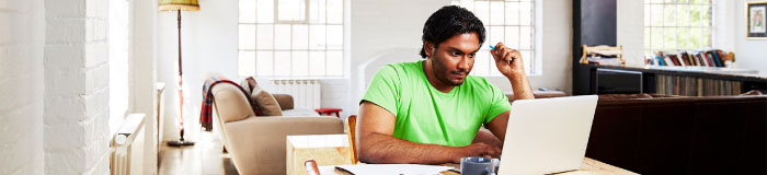 Man working at home on his computer